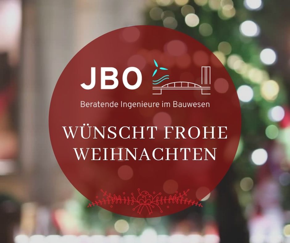 Red circular graphic with "JBO Beratende Ingenieure im Bauwesen wünscht frohe Weihnachten" text, placed over a blurred festive background with a Christmas tree.