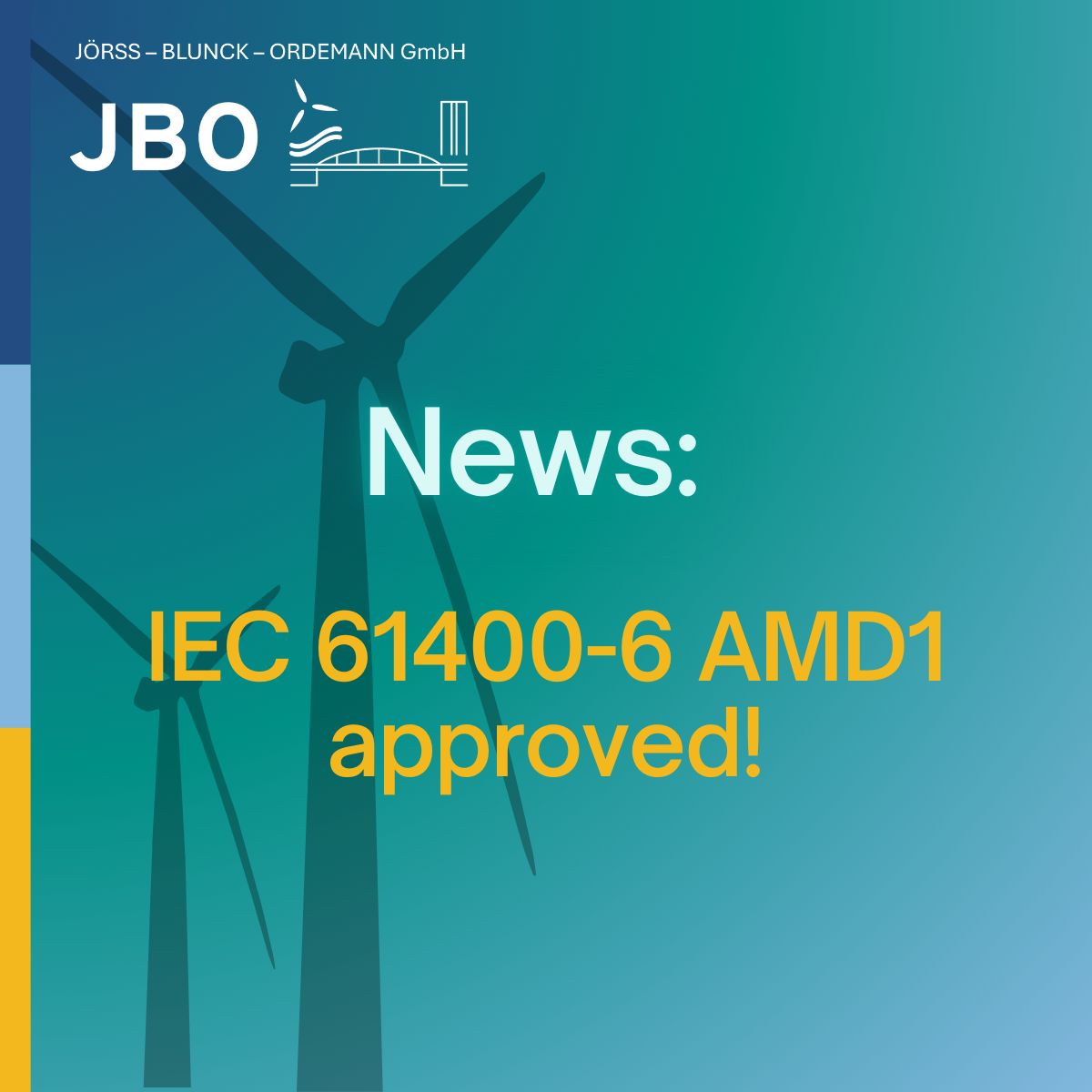 Two wind turbines with text: "News: IEC 61400-6 AMD1 approved!" and the JBO GmbH logo appear over a blue and green gradient background, highlighting the significance of IEC 61400-6 AMD1 in wind energy standards.